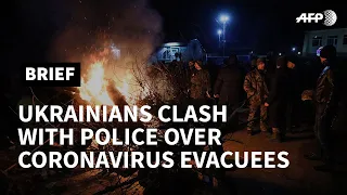 Ukraine protesters clash with police over China virus evacuees | AFP