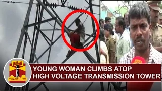 Young Woman climbs atop high-voltage transmission tower demanding New Electricity Connection