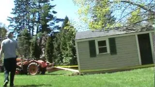 old kubota L185 pulling a shed