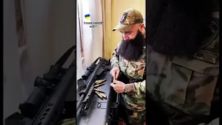 Ukrainian fighter preparing a NATO supplied 12.7mm Barrett M82 sniper rifle