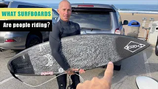 What surfboards are people riding?