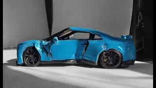 Crashed Nissan gtr r35 crash test machine for strength, from plasticine