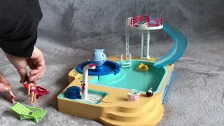 Playmobil swimming pool mum and kid go on the slide