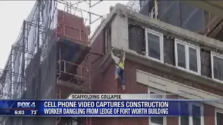 Man hangs off side of a building after scaffolding elevator collapses, 3 injured