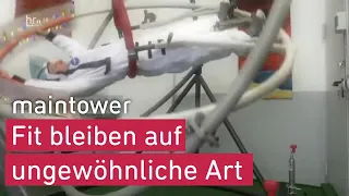 Mann trainiert wie ein Astronaut I maintower