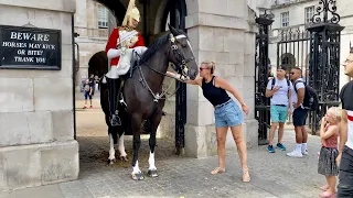 Lady Slips a Note in Horse Guards Boot