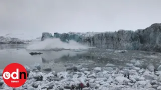 RUN! Huge wave from glacier collapse sends tourists running