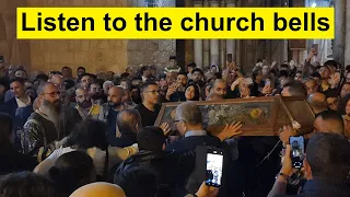 Jesus' funeral procession at the entrance of the Church of the Resurrection in Jerusalem.