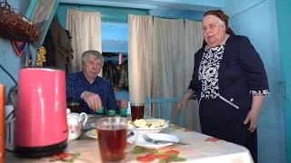 Happy old age of an elderly couple in Taiga Forest far from civilization. Life in villages of Russia