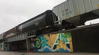 Freight train UNDER THE BRIDGE in downtown Davenport IA