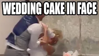 Groom smashing wedding cake in bride’s face