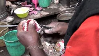 Roadside dentist of Varanasi making denture