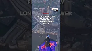 Skydivers become the first to fly through London's Tower Bridge