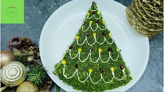 Delicious salad in the form of a Christmas tree,on the New Year's table.New recipe.Basil food channe