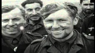 A line of German prisoners marched under US MP (Military Police) guard in Cistern...HD Stock Footage