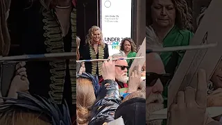 Roger Taylor (Queen) signing things at the We Will Rock You London Coliseum Gala Premiere - 7-6-2023