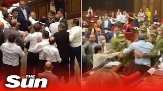 Shocking moment MPs brawl with the opposition party in Armenia