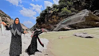 Fishing in the raging river by a nomadic woman🎣🏞️
