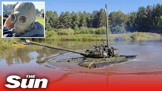 Armoured Russian tanks drive through WATER in explosive training drills