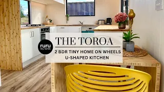 Ruru Tiny Homes: The Toroa - double storey two bedroom tiny home on wheels - U-shaped Kitchen