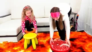 Lera and mom playing floor is a lava challenge.