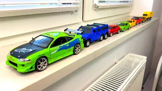 Bigger and Small Diecast model cars driven by hand on the windowsill - Compilation Video