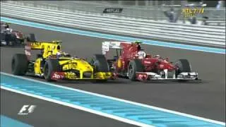 Alonso waving Petrov in Abu Dhabi 2010