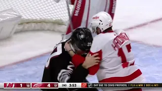 Michael McLeod drop the gloves with Filip Hronek