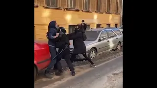 Anti-war protesters in Saint Petersburg confront Russian police attempting to arrest them.