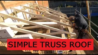 Fitting timber roof trusses to a small home extension.