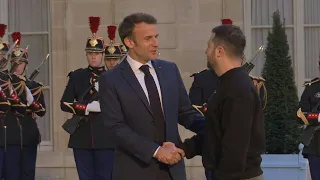 Volodymyr Zelensky welcomed by Emmanuel Macron at the Elysee Palace | AFP