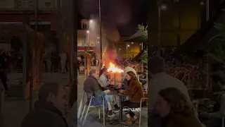 French diners enjoy wine as fire lit by protesters burns nearby | ABC News