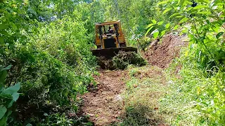 Caterpillar Bulldozer D6R XL Working to Repair Mountain Plantation Roads