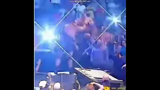 Big Show chokeslams Brock Lesnar through Announce table