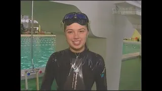 Girl learns to snorkel in a pool
