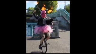 Darth Vader Doing Pirouettes in a Tutu While Riding a Unicycle and Playing Flaming Bagpipes