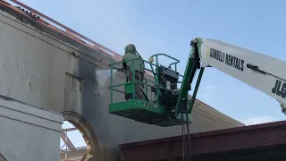 Dustless blasting to remove paint and plaster