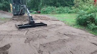 Volvo mini excavator with homemade grading beam.