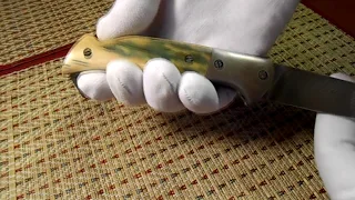 Нож складной из дамаска с накладками из бивня мамонта.