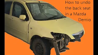 How to undo the back seat in a Mazda Demio