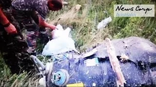 MH17 new footage: rebels discover debris is from a civilian aircraft