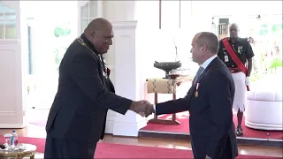 Fijian President officiates at the special investiture ceremony for H.E John Feakes