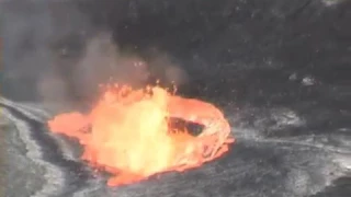 Eruption after person throw stone in lava lake of volcano