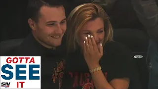 GOTTA SEE IT: Flames Fan Tears Up After Super Nice Kid Gives His Puck To Her