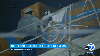 Caught in the act: Taggers target another LA building under construction