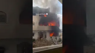 An Israeli soldier joyfully sings while watching a house burn in Gaza