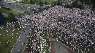 Tens of thousands march in Belarus capital despite massive police presence