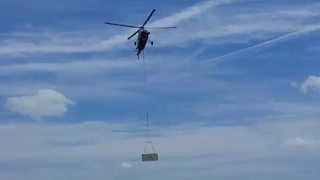 Setting AC units on huge warehouse w/ helicopter