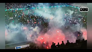 Saint-Étienne fans throw flares at players amid field storming after relegation.