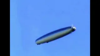 n the USA, a cigar-shaped UFO appeared in the sky.